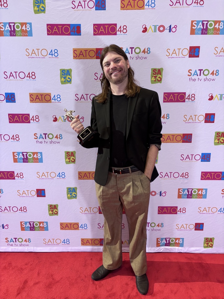 Jordan Corbett with the Best Screenplay award at the SATO48 premiere